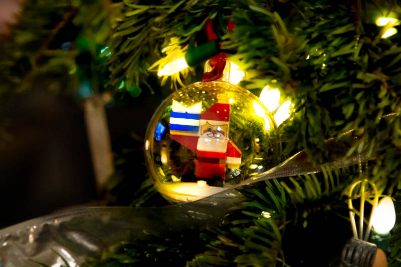 Holiday ornament detail — bokeh lights behind